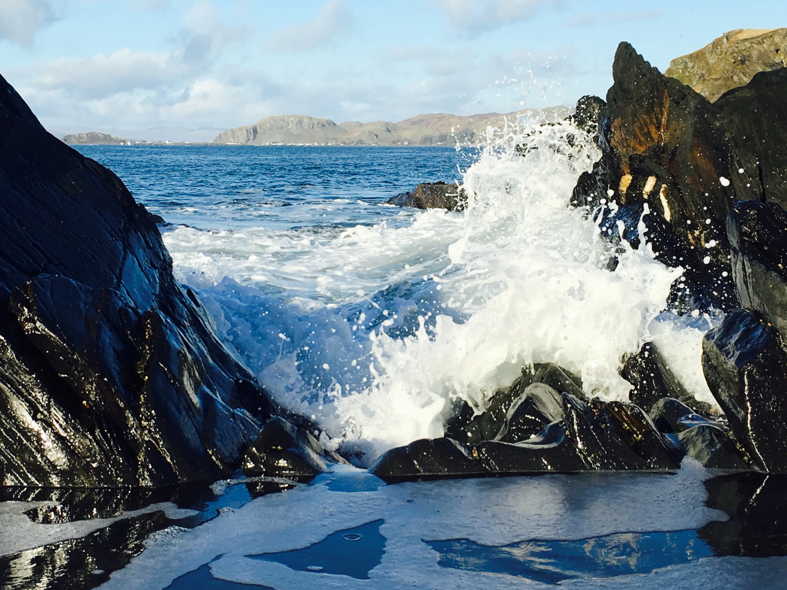 Waves crashing on the shore of Luing, one of Scotland's famous slate islands.