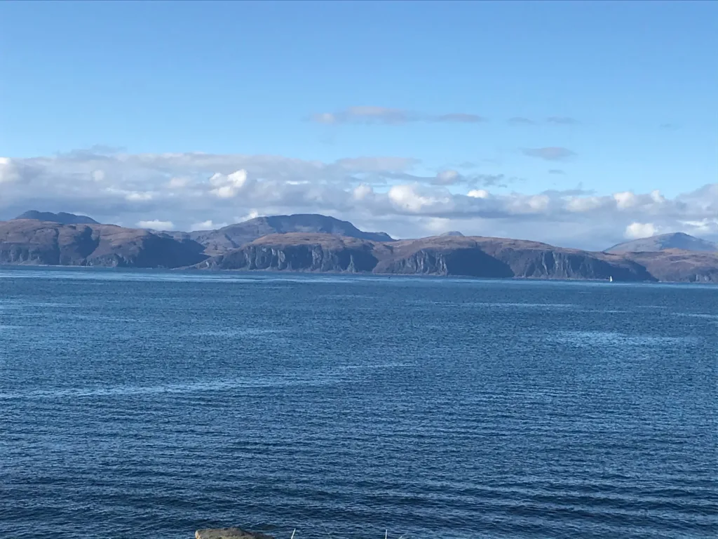 Isle of Mull pictured across the atlantic ocean from the isle of luing.